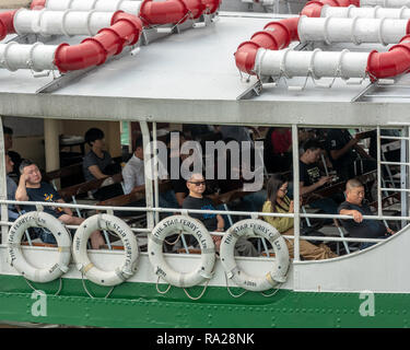 Passengers on the 'Solar Star' Star Ferry await docking at the Tsim Sha Tsui ferry pier on Kowloon. Stock Photo
