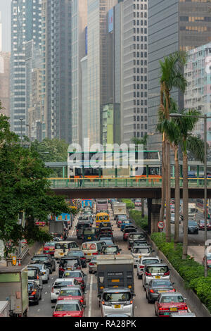 Lines of traffic fill Gloucester Road as they queue to enter the Cross-Harbour Tunnel Stock Photo