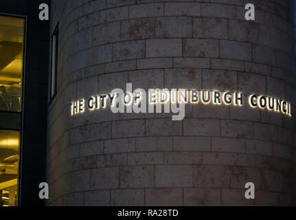 City of Edinburgh Council headquarters name lit up at night on building, Waverley Court, Edinburgh, Scotland, UK Stock Photo