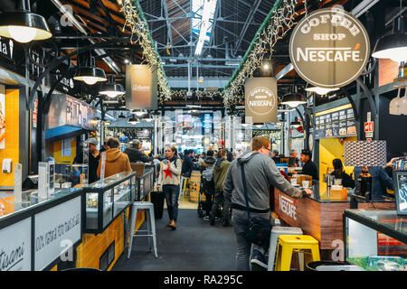 Lisbon, Portugal - Dec 30, 2018: Tourists Having Lunch At Lisbon Market Restaurant Of Mercado de Campo de Ourique In Lisbon Stock Photo