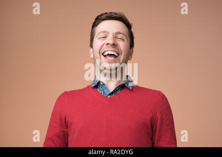 Portrait of a handsome young man laughing Stock Photo