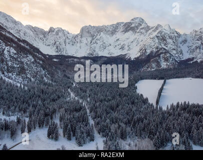 Aerial photo of beautiful winter landscape with snow covered trees in Italy Stock Photo