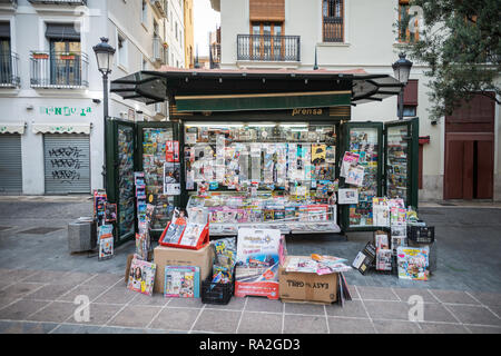 Magazines and newspapers on sale on a newsstand kiosk in the Old Town of Valencia, Spain. Stock Photo