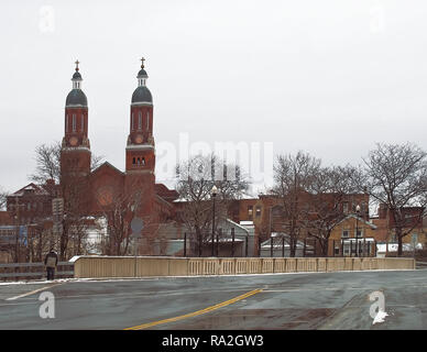 Syracuse, New York, USA. December 30, 2018. Catawba Street on Syracuse's north side with Assumption Church and the Little Italy neighborhood  on a win Stock Photo