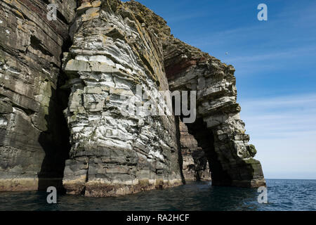 Rock formations on the Isle of Noss in the Shetland Islands of Scotland on a bright sunny day Stock Photo