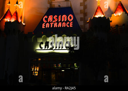 An outside night time view of neon and flood lights for the entrance to the Casino at the Excalibur Hotel and Casino in Las Vegas, NV Stock Photo
