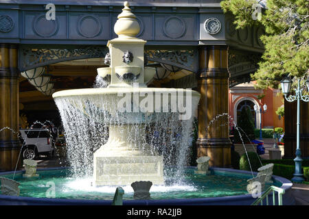A beautiful old world water fountain in front of the entrance to the Belliago Hotel & Casino valet parking area on the Strip in Las Vegas, NV Stock Photo
