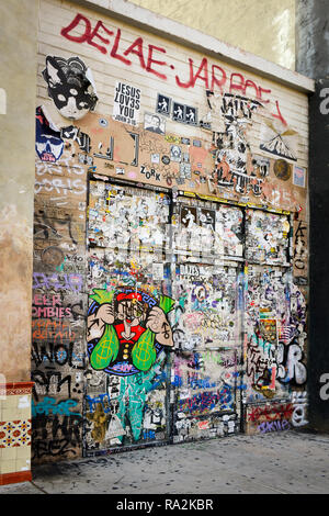 Massive and colorful graffiti on wall and doors of backdoor establishment in downtown Las Vegas, NV Stock Photo