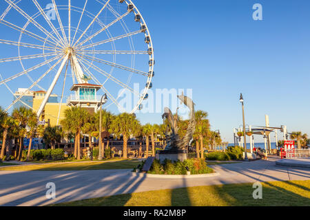Myrtle Beach, South Carolina, United States - October 29, 2018: Ferris wheel near the beach during a sunny sunset. Stock Photo