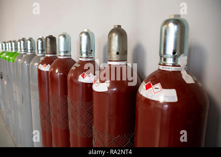 Seamless Steel Industrial Gas Cylinders. Pressurized Cylinder. Industrial stainless steel bottles in line. Stock Photo