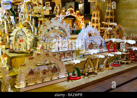 Wooden crafted toys and christmas decorations on stale on a booth at the traditional christmas market of Strasbourg, France, Europe. Stock Photo