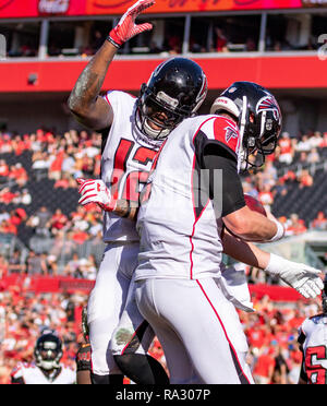 Tampa, Florida, USA. 30th Dec, 2018. Atlanta Falcons quarterback Matt Ryan (2) celebrates with Atlanta Falcons wide receiver Mohamed Sanu (12) after scoring a touchdown in the 3rd quarter during the game between the Atlanta Falcons and the Tampa Bay Buccaneers at Raymond James Stadium in Tampa, Florida. Atlanta win 34-32. Del Mecum/CSM/Alamy Live News Stock Photo