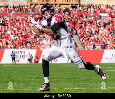 Tampa, Florida, USA. 30th Dec, 2018. Atlanta Falcons quarterback Matt Ryan (2) catches the pass from Atlanta Falcons wide receiver Mohamed Sanu (12) and runs in for a touchdown in the 3rd quarter during the game between the Atlanta Falcons and the Tampa Bay Buccaneers at Raymond James Stadium in Tampa, Florida. Atlanta win 34-32. Del Mecum/CSM/Alamy Live News Stock Photo