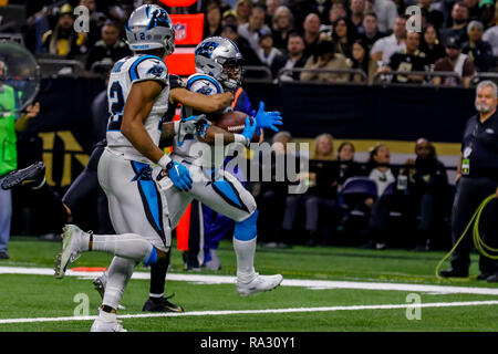 Carolina Panthers running back Cameron Artis-Payne (34) crosses the goal  line against New Orleans Saints cornerback Marshon Lattimore (23) on a  tcoudhown carry in the first half of an NFL football game