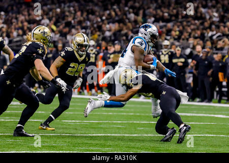 Carolina Panthers running back Cameron Artis-Payne (34) crosses the goal  line against New Orleans Saints cornerback Marshon Lattimore (23) on a  tcoudhown carry in the first half of an NFL football game