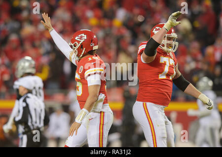 Kansas City, Missouri, USA. 30th Dec, 2018. Kansas City Chiefs quarterback Patrick Mahomes (15) and Kansas City Chiefs offensive guard Andrew Wylie (77) celebrate after a touchdown pass by Mahomes during the NFL Football Game between the Oakland Raiders and the Kansas City Chiefs at Arrowhead Stadium in Kansas City, Missouri. Kendall Shaw/CSM/Alamy Live News Stock Photo