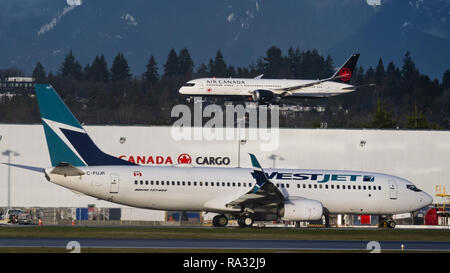 Richmond, British Columbia, Canada. 29th Dec, 2018. WestJet Airlines and Air Canada planes at Vancouver International Airport. Credit: Bayne Stanley/ZUMA Wire/Alamy Live News Stock Photo