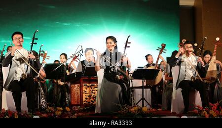 Kathmandu, Nepal. 30th Dec, 2018. Chinese artists perform during a musical concert to mark the New Year in Kathmandu, Nepal, Dec. 30, 2018. A special concert by China's Guizhou Provincial Qian Opera Theater was held here on Sunday to celebrate the upcoming New Year 2019 and to enhance Sino-Nepali cultural exchanges. The concert was featured a range of opera theater performances, from folk to modern, by young Chinese musicians. Credit: Sunil Sharma/Xinhua/Alamy Live News Stock Photo