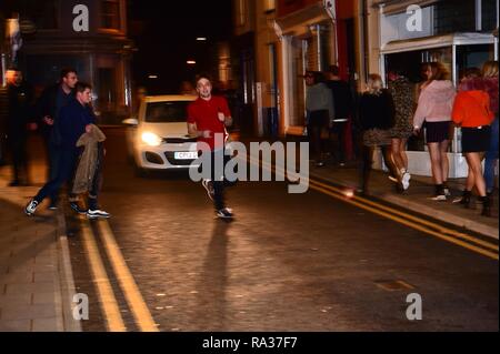 Aberystwyth Wales UK, New Year’s Celebrations Dec 31  2018 - January 01 2019  People out on the streets celebrating the start of the new year 2019 in Aberystwyth on the west coast of Wales   photo © Keith Morris / Alamy Live News Stock Photo