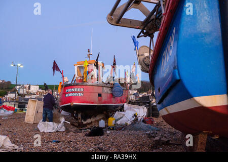 Hastings East Sussex, UK. 1st Jan, 2019. Lone fisherman working at dawn on New Year's Day. Hastings with 25 working boats has one of the largest beach launched fishing boat fleets in Europe. Stock Photo