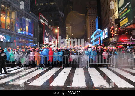 New York, New York, USA. 31st Dec, 2018. People are seen gathered at the Times Square during the New Year's Eve celebrations.Despite all day rain, More than 2 million people participate at the New Year's Eve celebrations at the Times Square. Credit: Ryan Rahman/SOPA Images/ZUMA Wire/Alamy Live News Stock Photo
