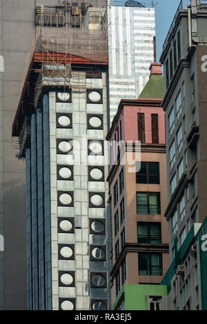Wildly contrasting styles are a feature of the apartment and office blocks that line Hong Kong's Lockhart Road in Wan Chai Stock Photo
