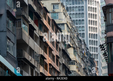Derelict, densely packed and modern apartment blocks line Percival Street in Causeway Bay on Hong Kong Island Stock Photo