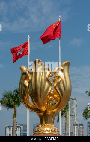 The 'Forever Blooming Golden Bauhinia Sculpture' which lends its name to Golden Bauhinia Square at Hong Kong's Convention and Exhibition Centre Stock Photo