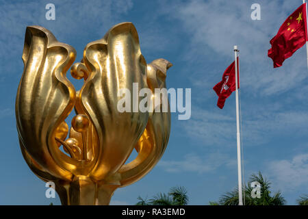 The 'Forever Blooming Golden Bauhinia Sculpture' which lends its name to Golden Bauhinia Square at Hong Kong's Convention and Exhibition Centre Stock Photo