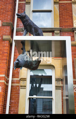 Life-size bronze sculpture of wolves part of a sculptural installation called Inversion by Eldon Garnet, James Cooper Mansion, Toronto,Ontario, Canada Stock Photo