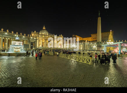Rome (Italy) - The Saint Peter in Vatican with the dome during the Christmas holidays. Here in particular the Nativity scene and Christmas tree Stock Photo