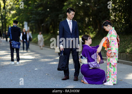 Children with parents in kimono standing in fight stance during group ...