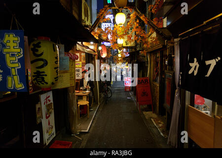 Hot and smoky Tokyo street restaurants, as locals eat and drink into ...