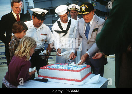 1979 - After the Bob Hope show aboard the amphibious assault ship USS IWO JIMA (LPH-2), Bob Hope is honored with a cake for his 76th birthday. Stock Photo