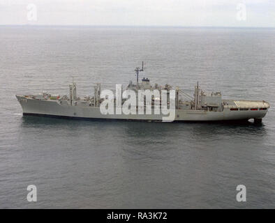 1971  - an aerial port beam view of the combat stores ship USS SAN JOSE (AFS-7) off the coast of San Diego. Stock Photo