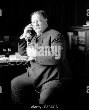 William Howard Taft talking on telephone ca. 1905-1930 Stock Photo
