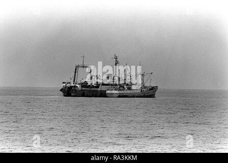 1979 - A starboard beam view of a Soviet trawler anchored offshore during exercise Unitas XX. Stock Photo
