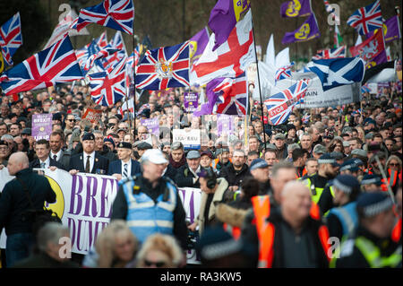 London, UK. 9th December 2018.  English Defence League founder Tommy Robinson heads a 'Brexit Betrayal' march, organised by UKIP. A counter-protest ag