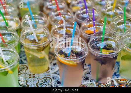 Fresh fruit shakes in plastic cups closeup outdoor Stock Photo