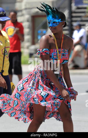 Montreal, Canada.A young woman dances in the  Carifiesta parade in downtown Montreal. Stock Photo