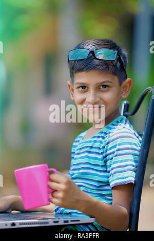 Child working on laptop Stock Photo