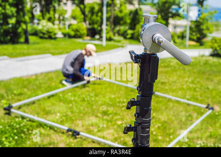 Grip team, light depurtment members prepare the lighting equipment before shooting Stock Photo