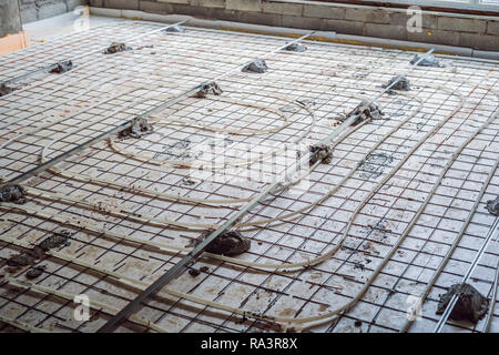 Pipe fitter mounted underfloor heating. Heating system and underfloor heating Stock Photo