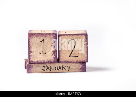 Colorful Wooden Block Perpetual Calendar Showing January 12th Stock Photo