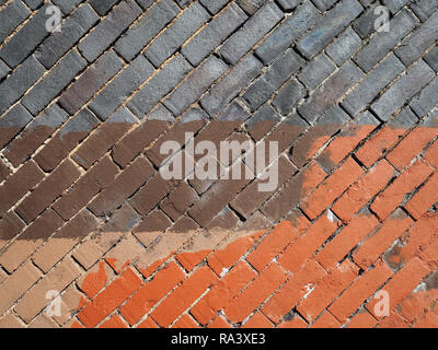 Diagonal brick wall, blue brown and orange paint Stock Photo