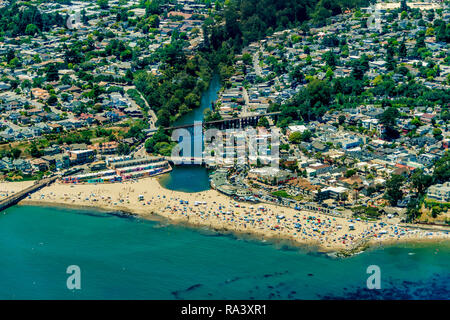 The aerial view of the beach with tourists in the city of Capitola in Northern California, close to the city of Santa Cruz. Stock Photo