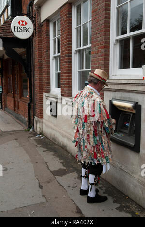 ATM cash machine. Kennet Morris men at a hole in the wall ATM in the village of Goring, Berkshire, England. HOMER SYKES Stock Photo