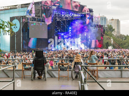 KIEV, UKRAINE - JULY 04, 2018: People enjoy live concert at special place for disabled at the Atlas Weekend Festival in National Expocenter. Stock Photo