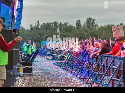 KIEV, UKRAINE - JULY 04, 2018: Fans crowd enjoy rock band live performance at the Atlas Weekend Festival in National Expocenter. Stock Photo