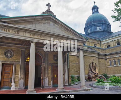 Our Lady of Lourdes Church and apparition of Mary in Lourdes statue, Toronto, Ontario, Canada Stock Photo